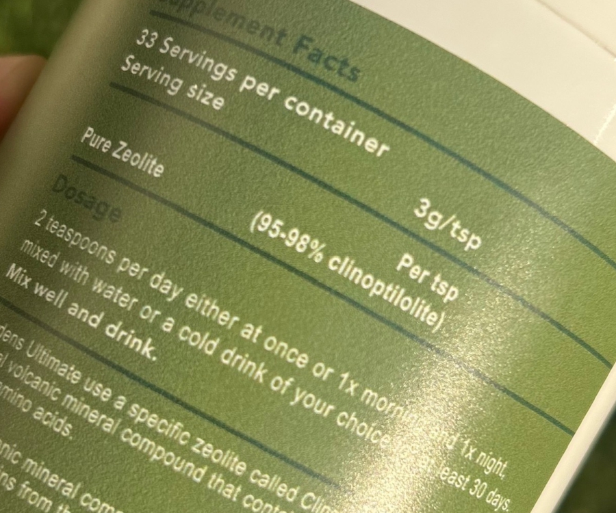 Dr-Ria-Smit-nordens-ultimate-zeolite-supplement-facts-label Close-up of Nordens Ultimate Zeolite supplement label showing supplement facts, dosage of 2 teaspoons per day, 95-98% clinoptilolite content, and usage instructions for detoxification